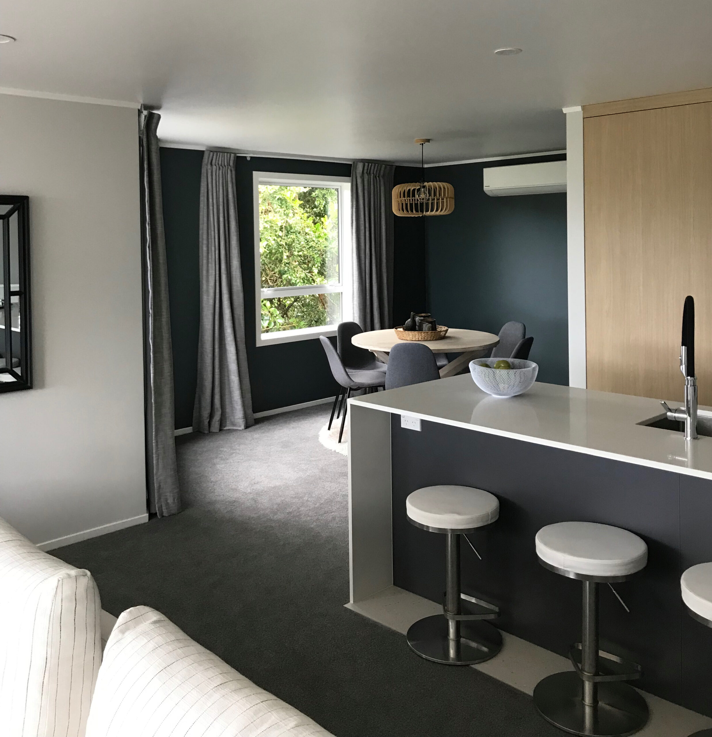 Dark dining walls creating cosy room