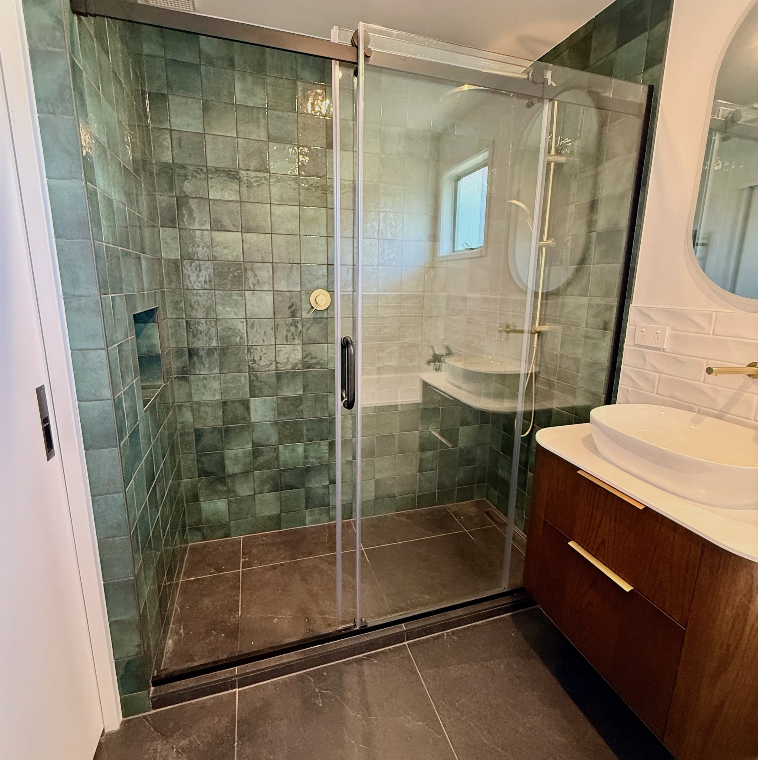 Green tiles in shower renovation